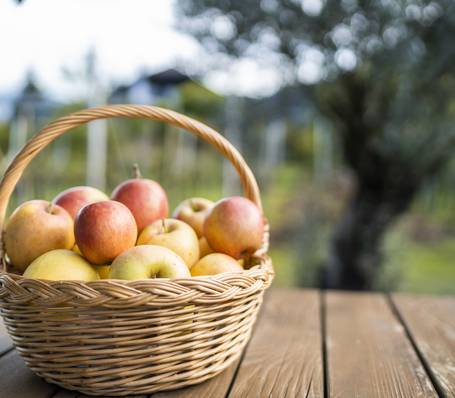 Modern alpine hotel room with double bed, wooden furniture, and mountain view in South Tyrol