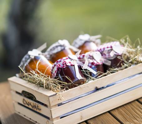 Modern alpine hotel room with wooden furniture and mountain view at Sonngart Hotel South Tyrol