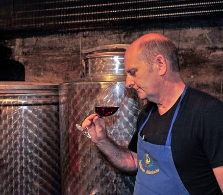 Wine cellar with wooden barrels at Sonngart winery in South Tyrol