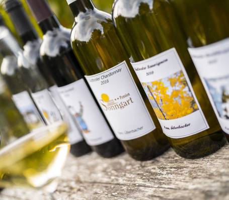 Modern hotel room with wooden furniture and mountain view at Sonngart Hotel in South Tyrol