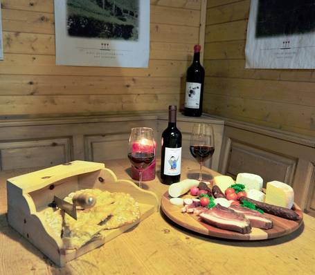 Wine cellar with wooden barrels at Sonngart winery in South Tyrol
